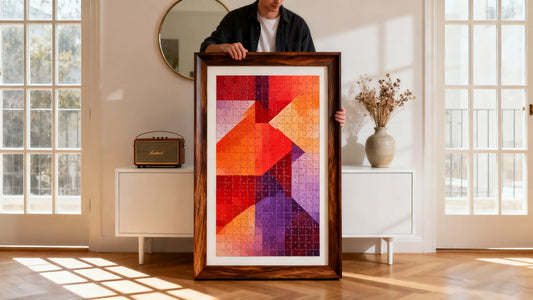 A person framing a colorful jigsaw puzzle without glue using a wooden frame on a table
